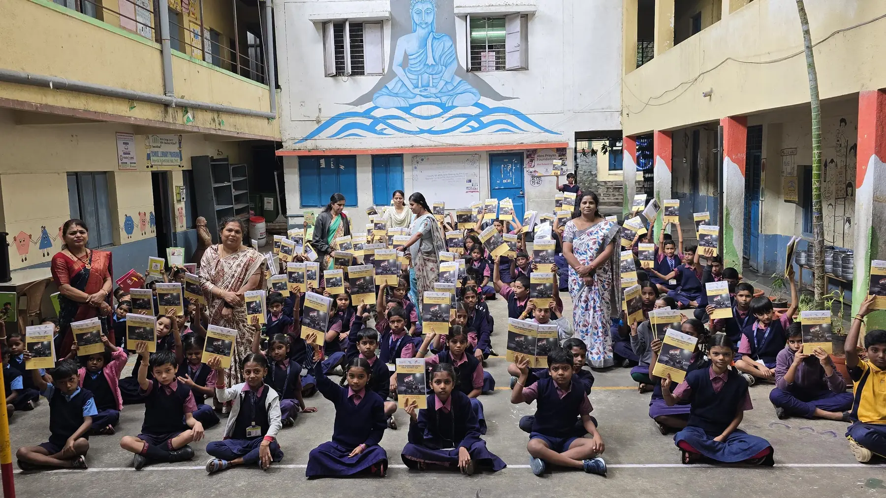 Eight hundred notebooks handed out in the courtyard at Government School, Sunkenahalli